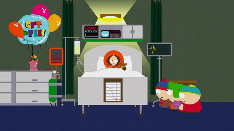 Kenny in bed dying, being visited by Stan, Kyle, and Cartman on South Park.